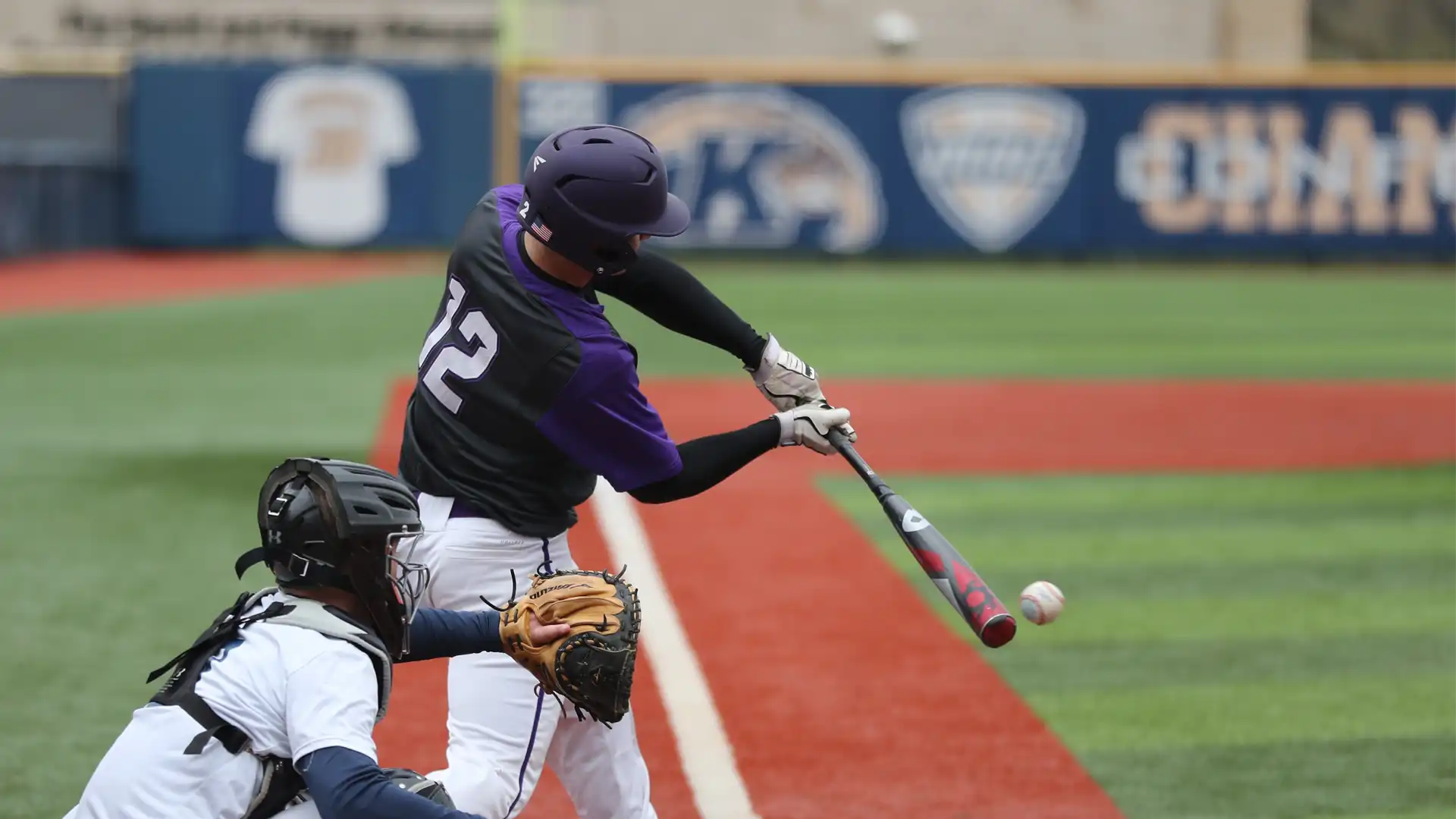 A photo of a baseball player batting and almost hitting the ball in one swing. Image is used to demonstrate how to move an object in Adobe Photoshop quickly and easily.